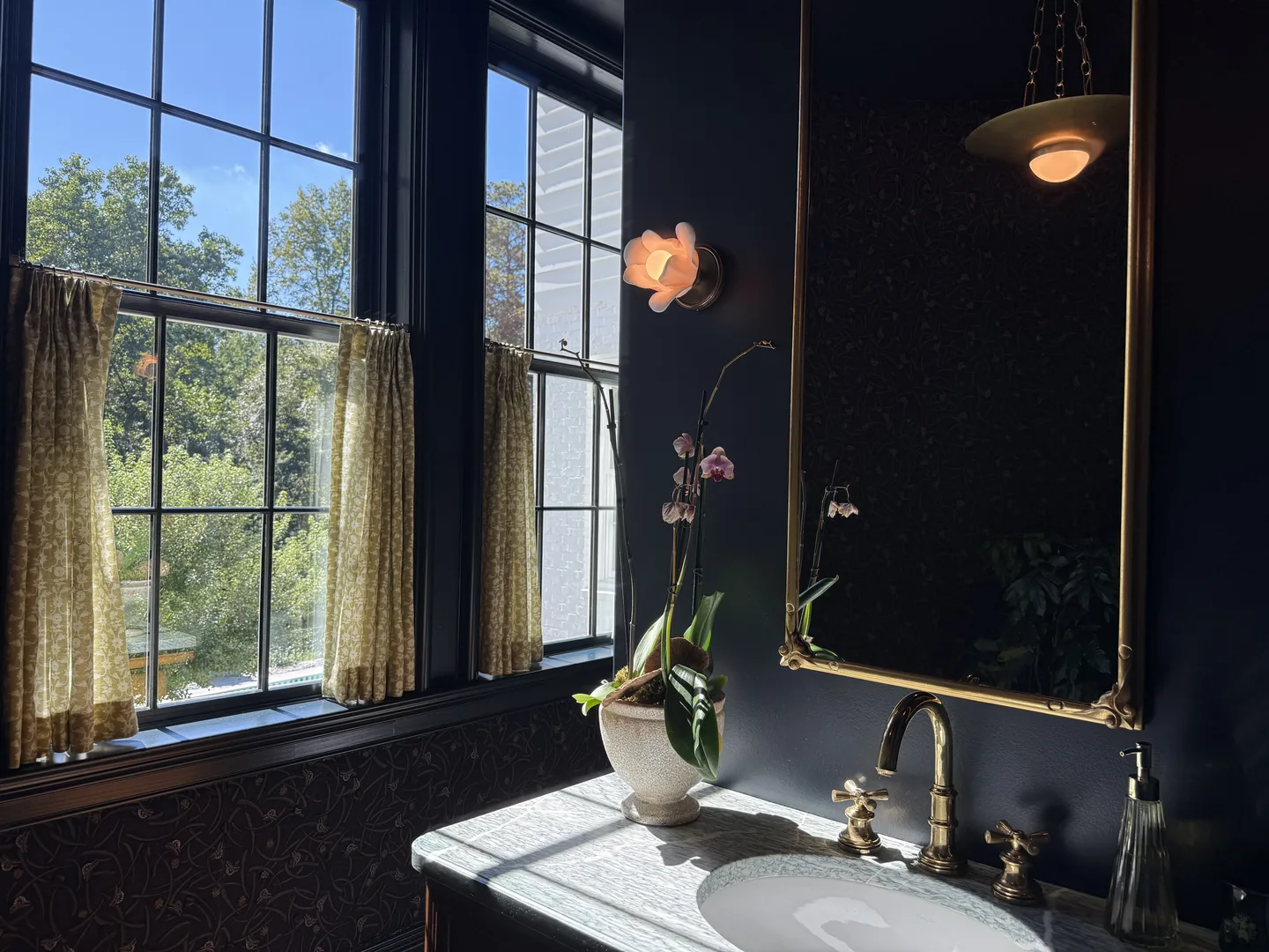 Powder room with natural sunlight and classic vanity