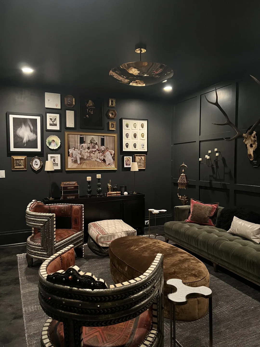 Curated salon with art gallery wall and tufted lounge