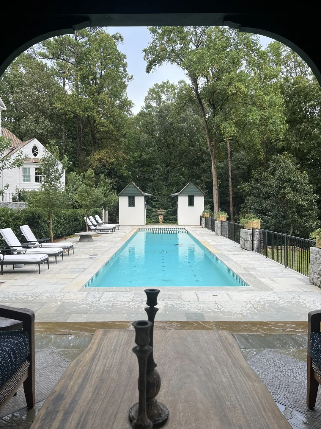 Estate lap pool and symmetrical pavilion cabanas