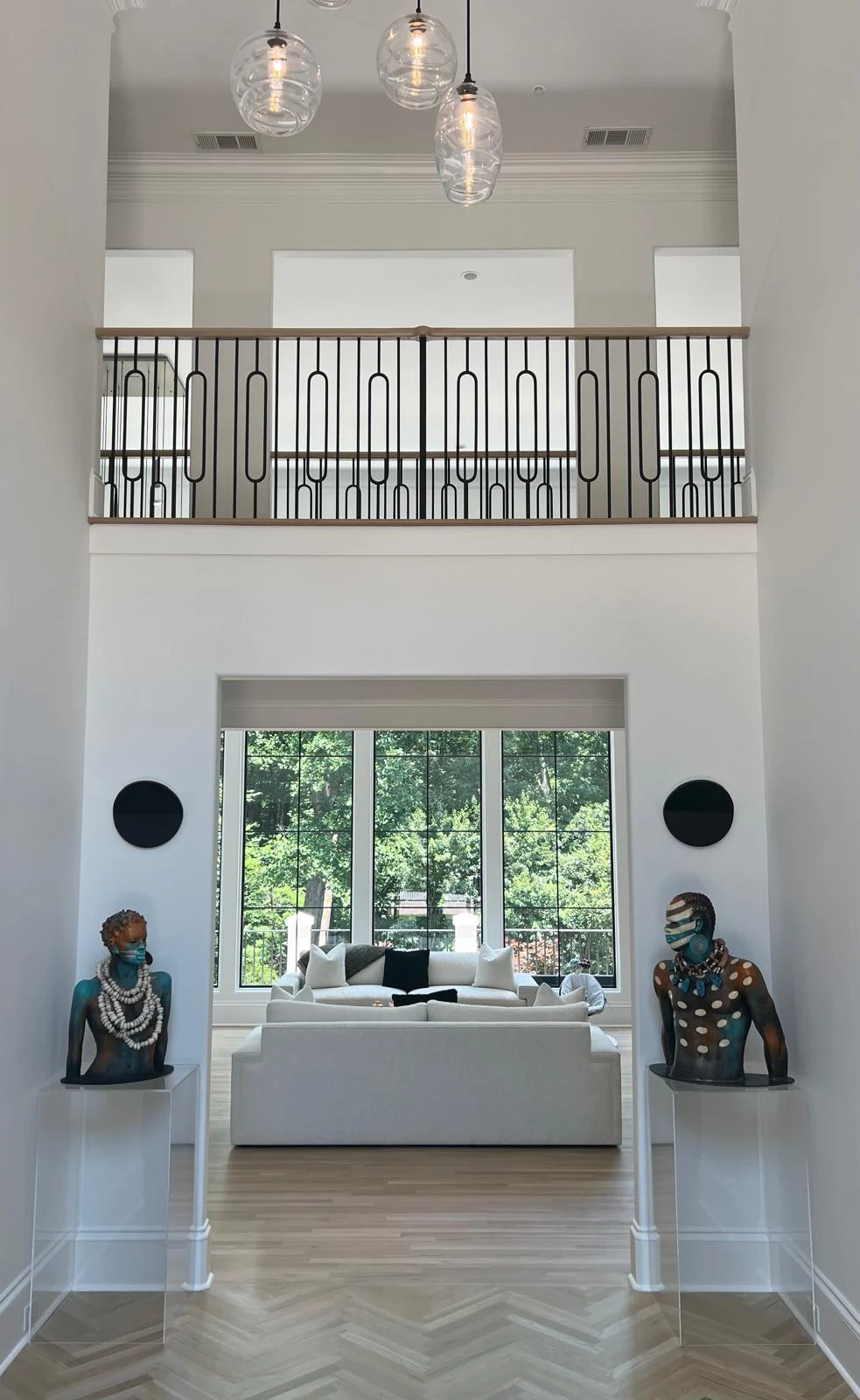 Grand architectural foyer and mezzanine staircase in Atlanta estate