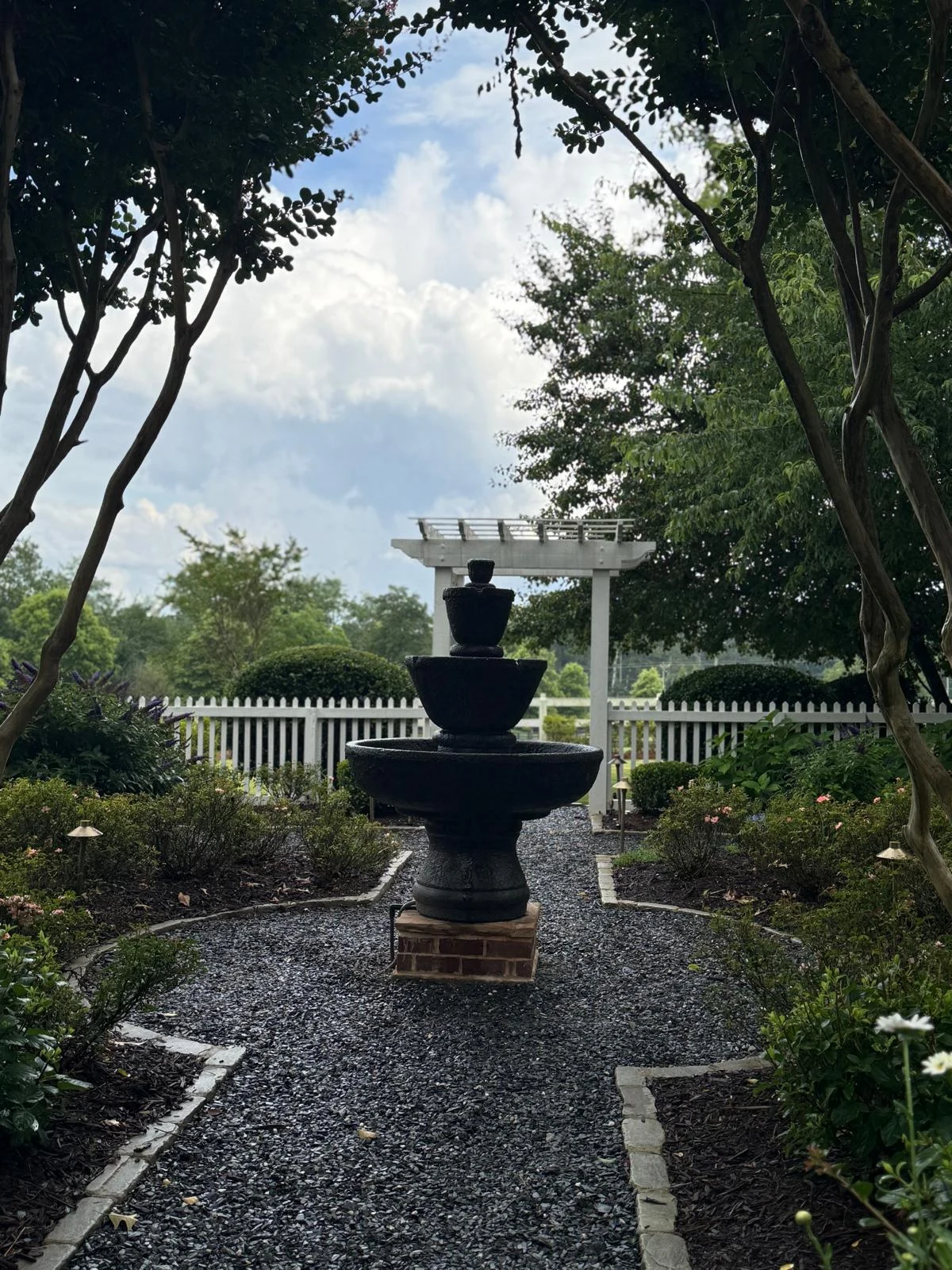 Private Georgia estate grounds with classical stone fountain and arbor