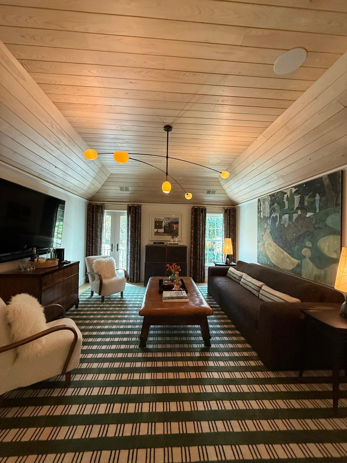 Private boutique studio lounge with beamed ceilings and fine finishes